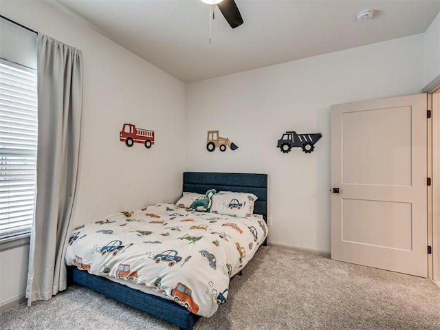 bedroom featuring ceiling fan and light carpet