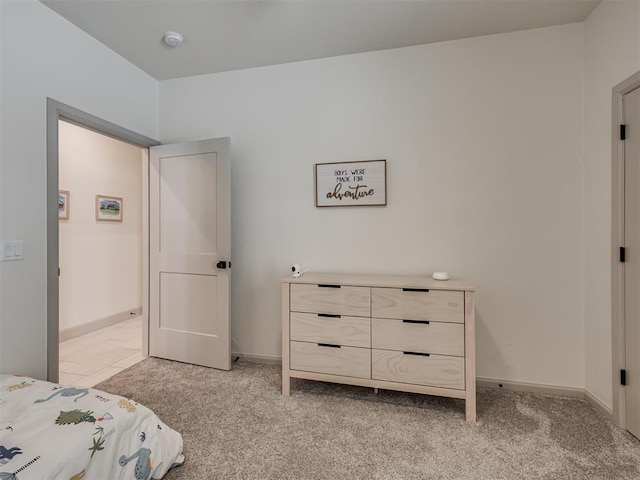 bedroom featuring light carpet