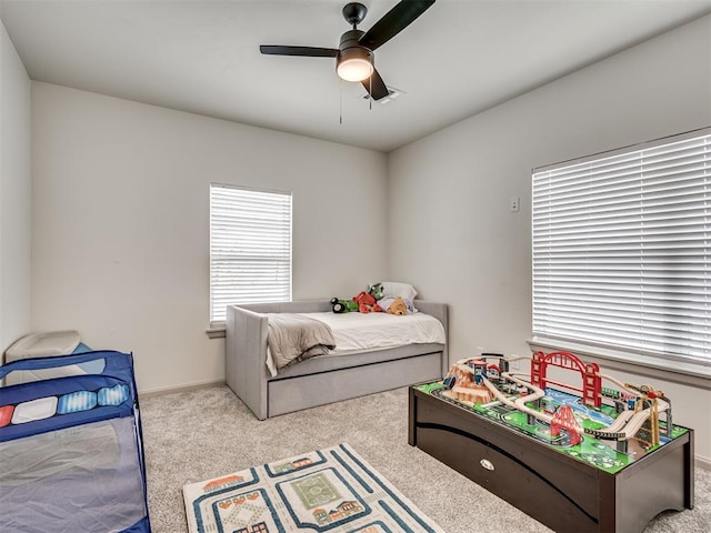 carpeted bedroom featuring ceiling fan