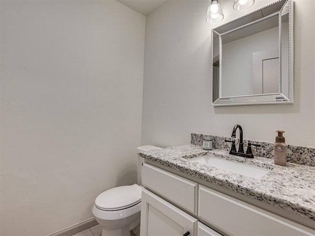 bathroom with tile patterned floors, toilet, and vanity