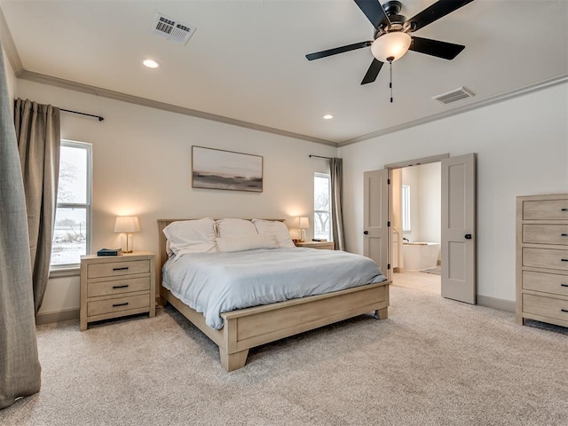 bedroom with ceiling fan, ensuite bath, crown molding, and light carpet