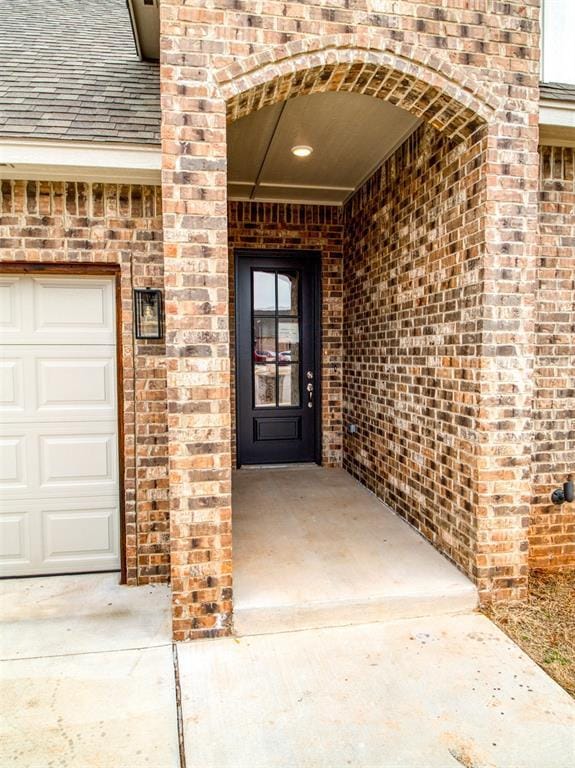 property entrance with a garage