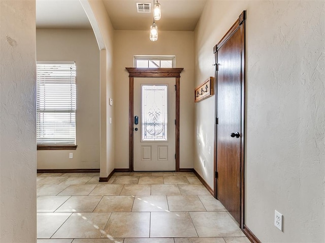 entryway featuring light tile patterned floors