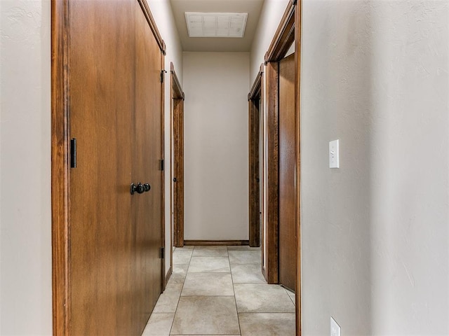 hallway with light tile patterned flooring