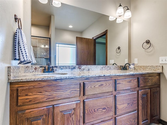 bathroom with vanity and an enclosed shower