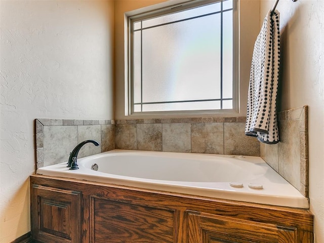 bathroom featuring a washtub