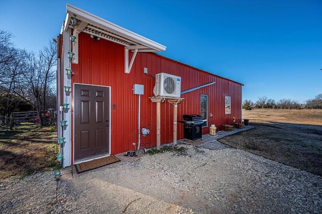 view of outdoor structure with ac unit