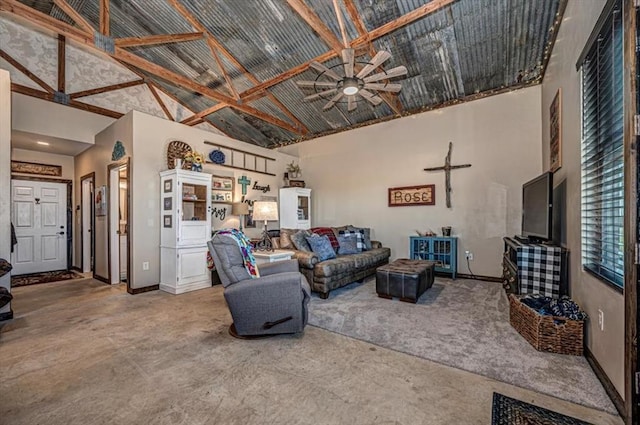 living room with concrete floors, high vaulted ceiling, and ceiling fan