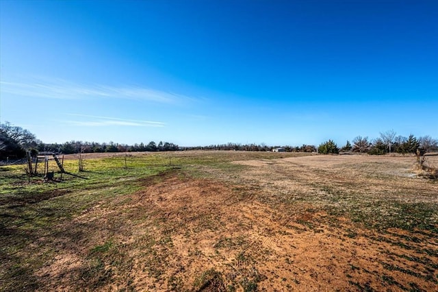 view of yard with a rural view