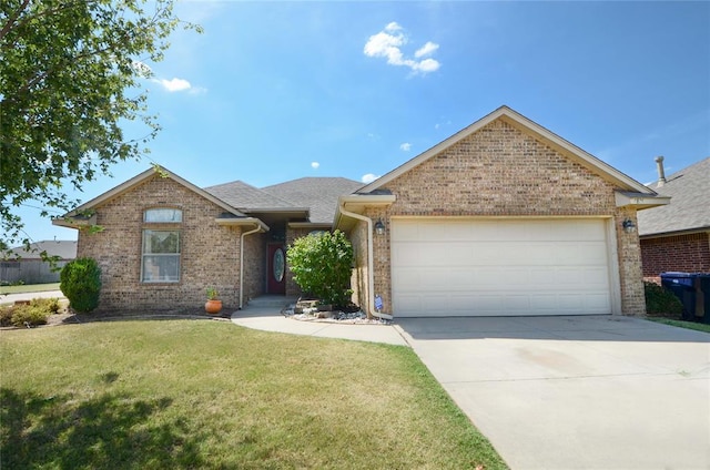 view of front of home with a garage and a front lawn