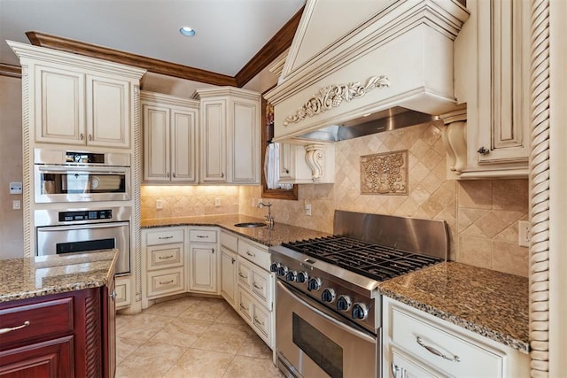 kitchen with custom exhaust hood, appliances with stainless steel finishes, backsplash, crown molding, and sink