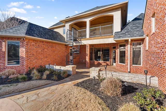 back of house with a balcony