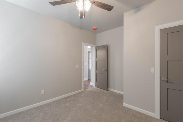 1300 Colonial Ave, Tuttle, OK 73089 - unfurnished bedroom featuring ceiling fan and light colored carpet