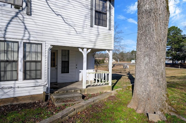 property entrance featuring a porch