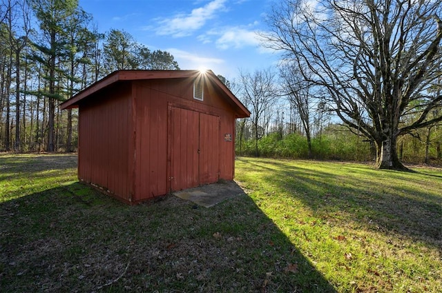 view of outdoor structure with a lawn