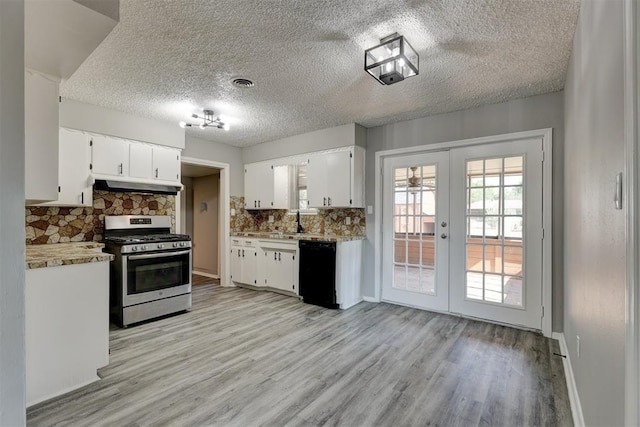 kitchen featuring backsplash, french doors, stainless steel gas stove, black dishwasher, and white cabinetry