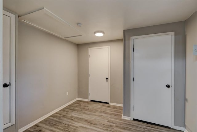 unfurnished bedroom featuring light wood-type flooring