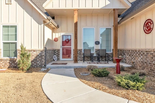 1305 Katelyn Ct, Yukon, OK 73099 - entrance to property featuring board and batten siding and roof with shingles