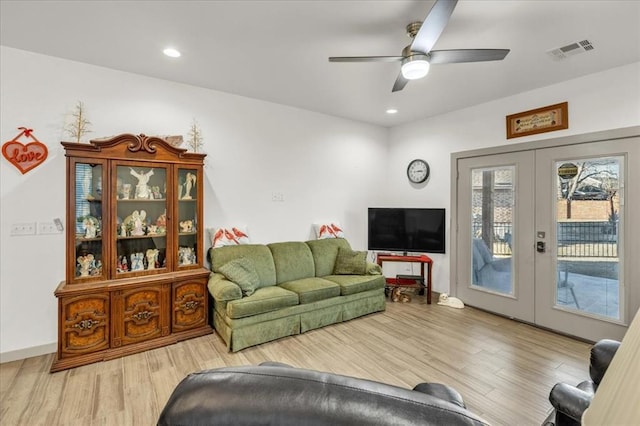 1305 Katelyn Ct, Yukon, OK 73099 - living room with french doors, wood finished floors, ceiling fan, and recessed lighting