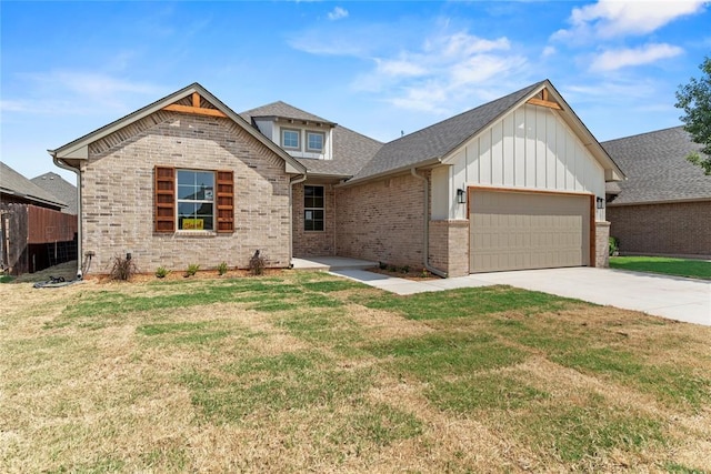 craftsman inspired home featuring a front yard and a garage