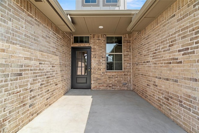 entrance to property featuring a patio area