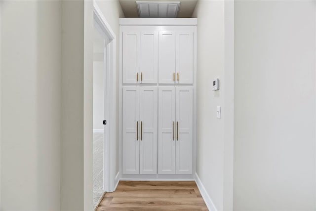 hallway featuring light hardwood / wood-style flooring