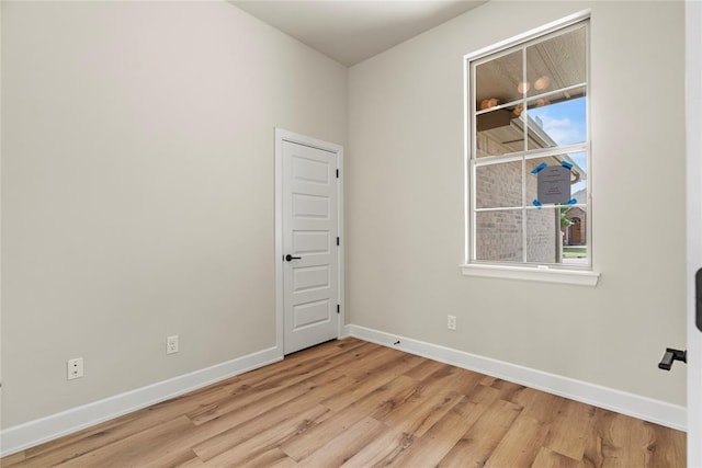 unfurnished room featuring light hardwood / wood-style floors