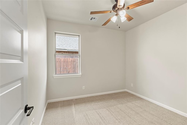 carpeted empty room featuring ceiling fan