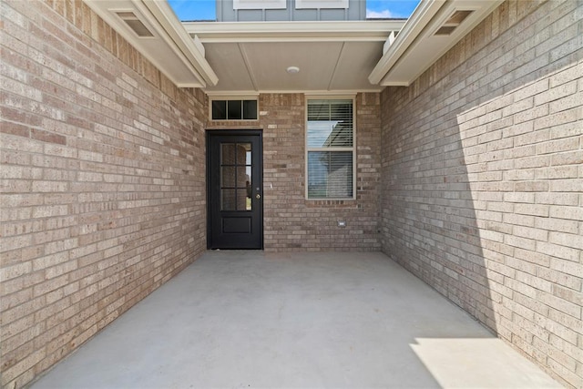 doorway to property featuring a patio area