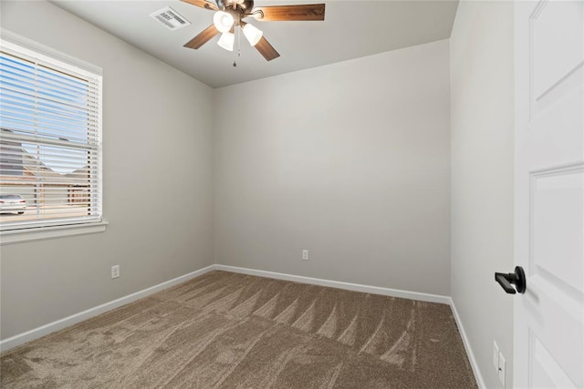 spare room featuring ceiling fan and light colored carpet