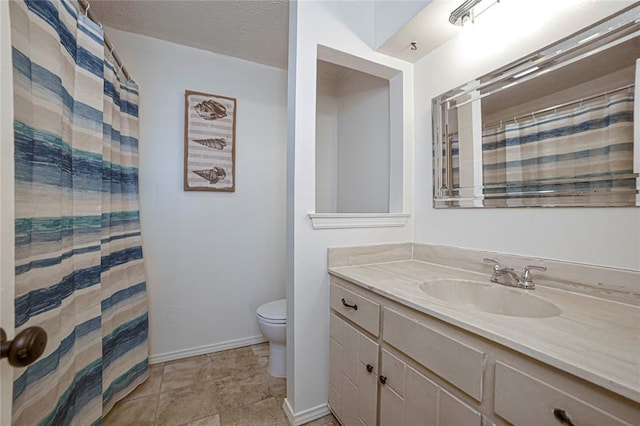 bathroom featuring vanity, a textured ceiling, a shower with curtain, and toilet