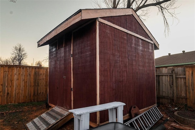 view of outdoor structure at dusk