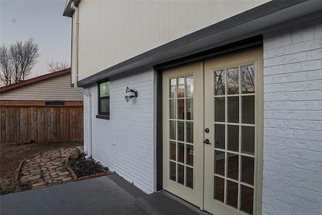 view of side of property with french doors