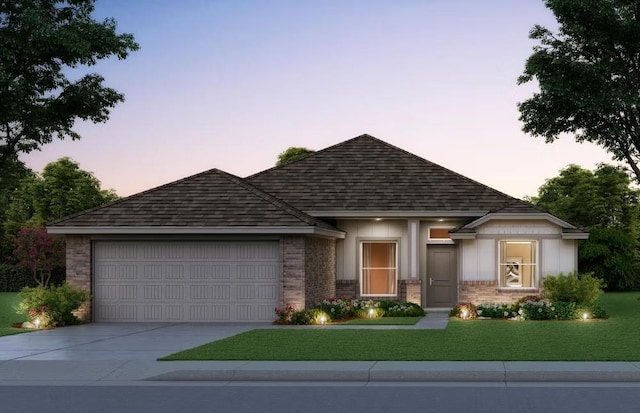 view of front of house featuring brick siding, driveway, an attached garage, and a front yard