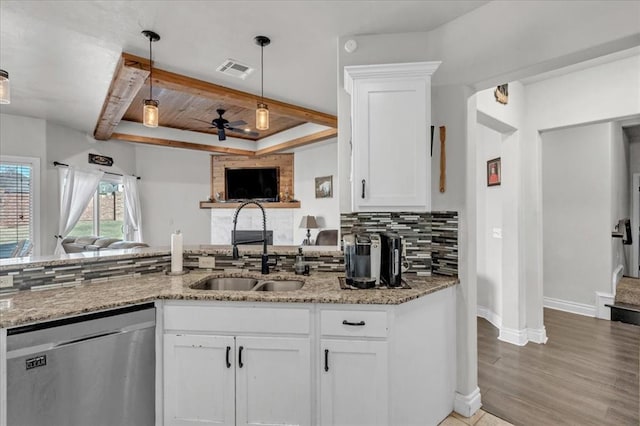 kitchen with white cabinetry, sink, ceiling fan, and stainless steel dishwasher