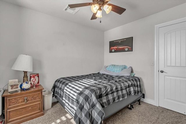 bedroom with ceiling fan and light carpet