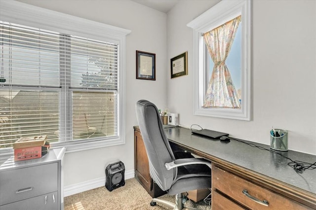 home office with plenty of natural light and baseboards