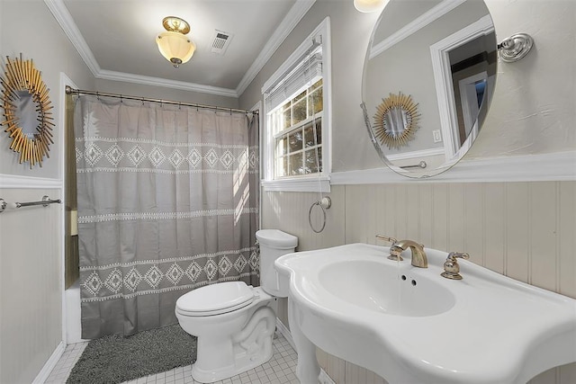 bathroom with tile patterned flooring, ornamental molding, shower / bath combination with curtain, and toilet