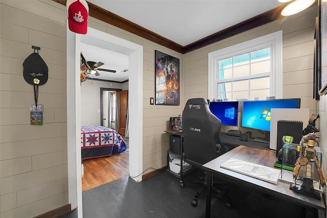 office area with dark hardwood / wood-style flooring, crown molding, and ceiling fan