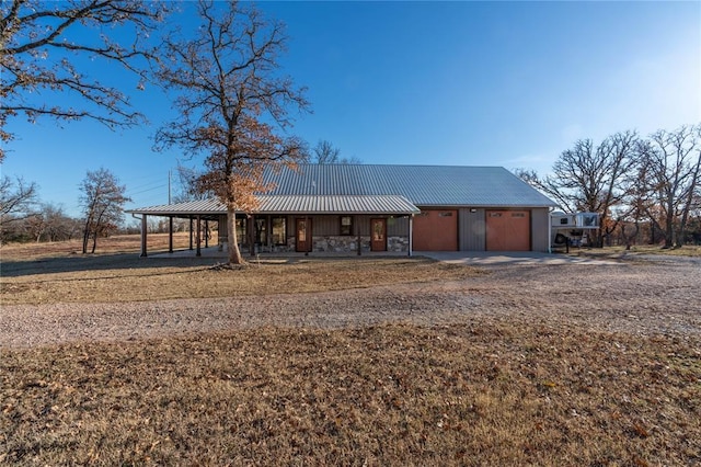 ranch-style house with a carport and covered porch