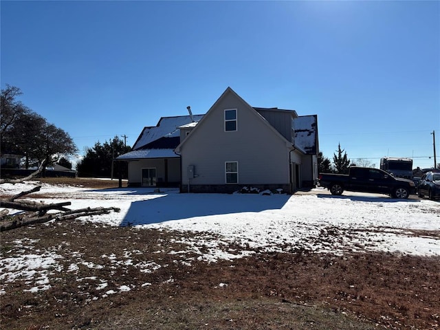 view of snow covered house