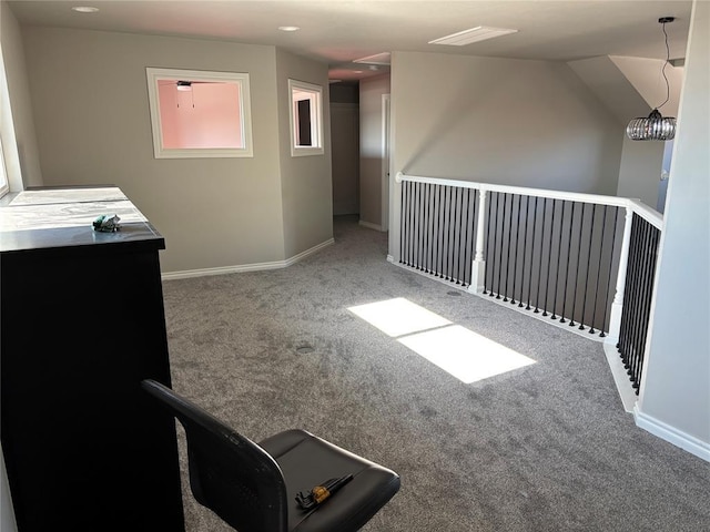 unfurnished room with carpet floors and a notable chandelier