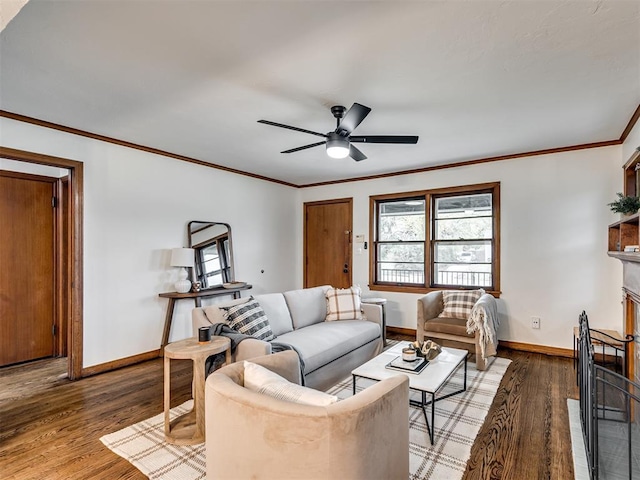 living room featuring hardwood / wood-style floors, ceiling fan, and ornamental molding