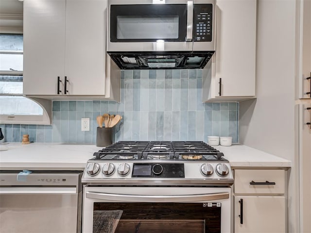 kitchen with tasteful backsplash, light stone countertops, and stainless steel appliances