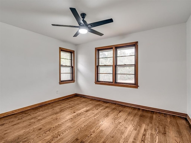 spare room featuring light hardwood / wood-style flooring and ceiling fan