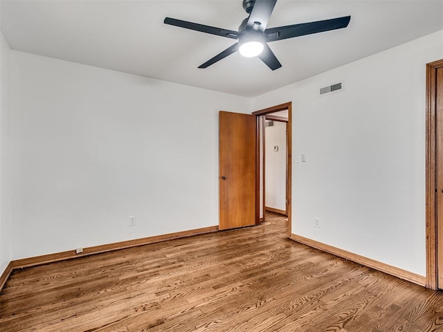 unfurnished room with ceiling fan and light wood-type flooring