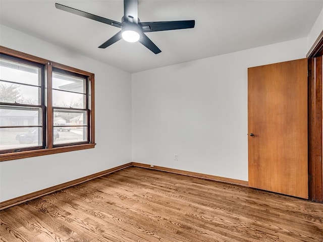 empty room featuring ceiling fan and wood-type flooring