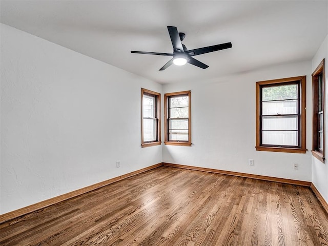 spare room featuring ceiling fan and hardwood / wood-style floors