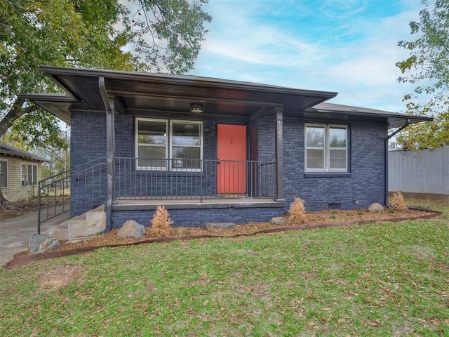 view of front of property with a porch and a front yard