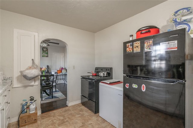 kitchen featuring white cabinets and black appliances